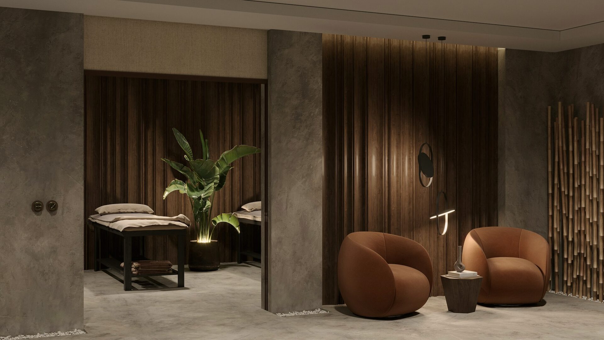 The treatment suite — warm wood, stone and low light