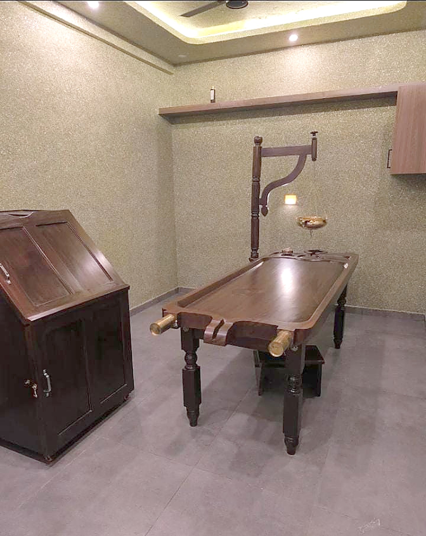 The Ayurveda room, with its wooden droni and Shirodhara stand